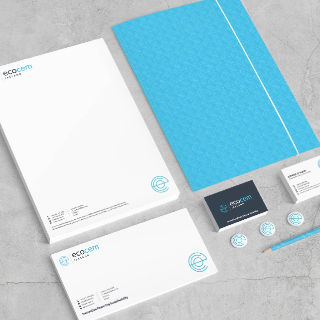 Display of Ecocem branding stationery on textured concrete background