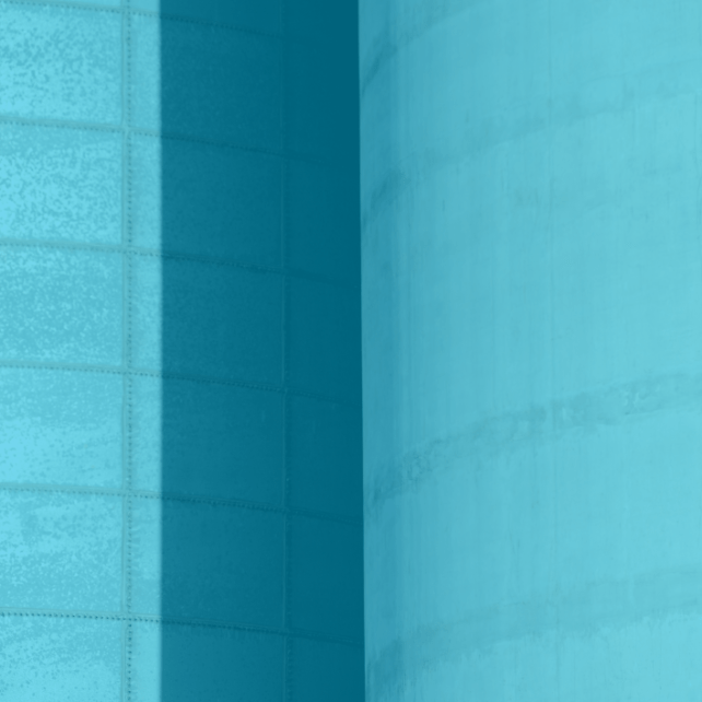 Two cement block towers with blue overlay
