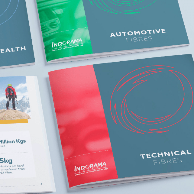 Various colour coded wellman brochures displayed on flat surface