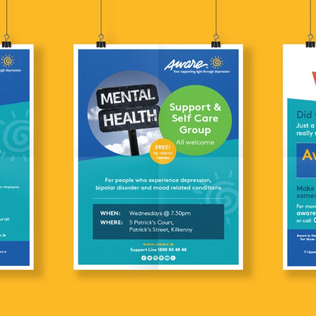 Aware Charity Northern Ireland hanging three poster designs on yellow background